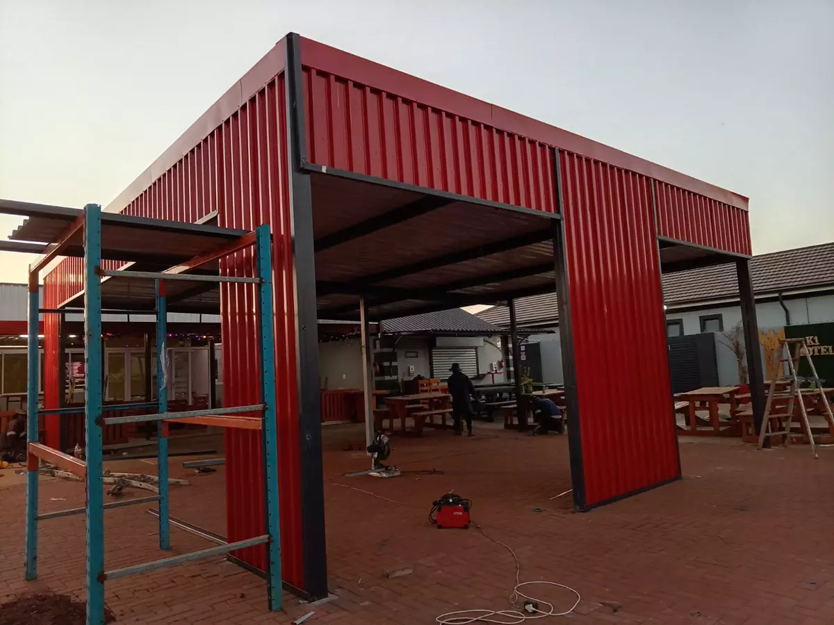 Red steel-frame building put up by QG Welding