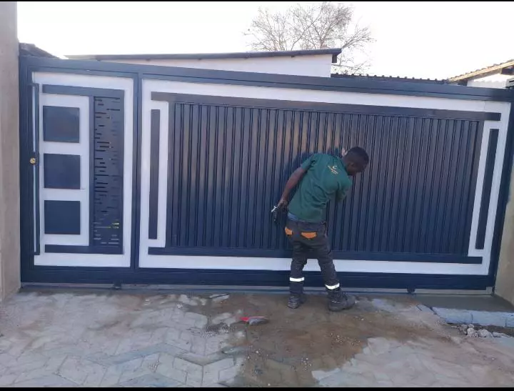 Painting a black and white sliding gate